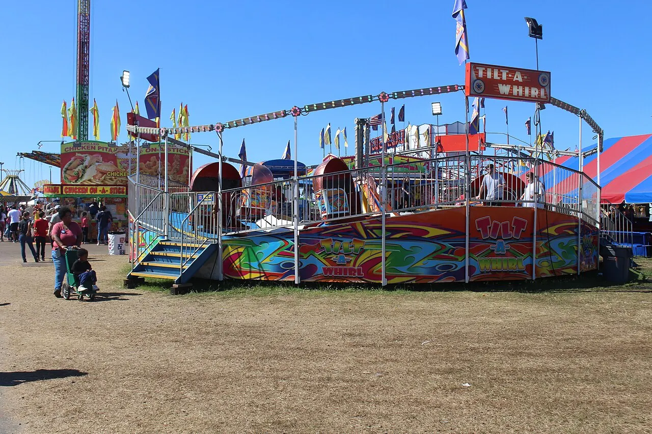 Visitors and colorful midway rides at the Georgia National Fair in Perry in 2024.