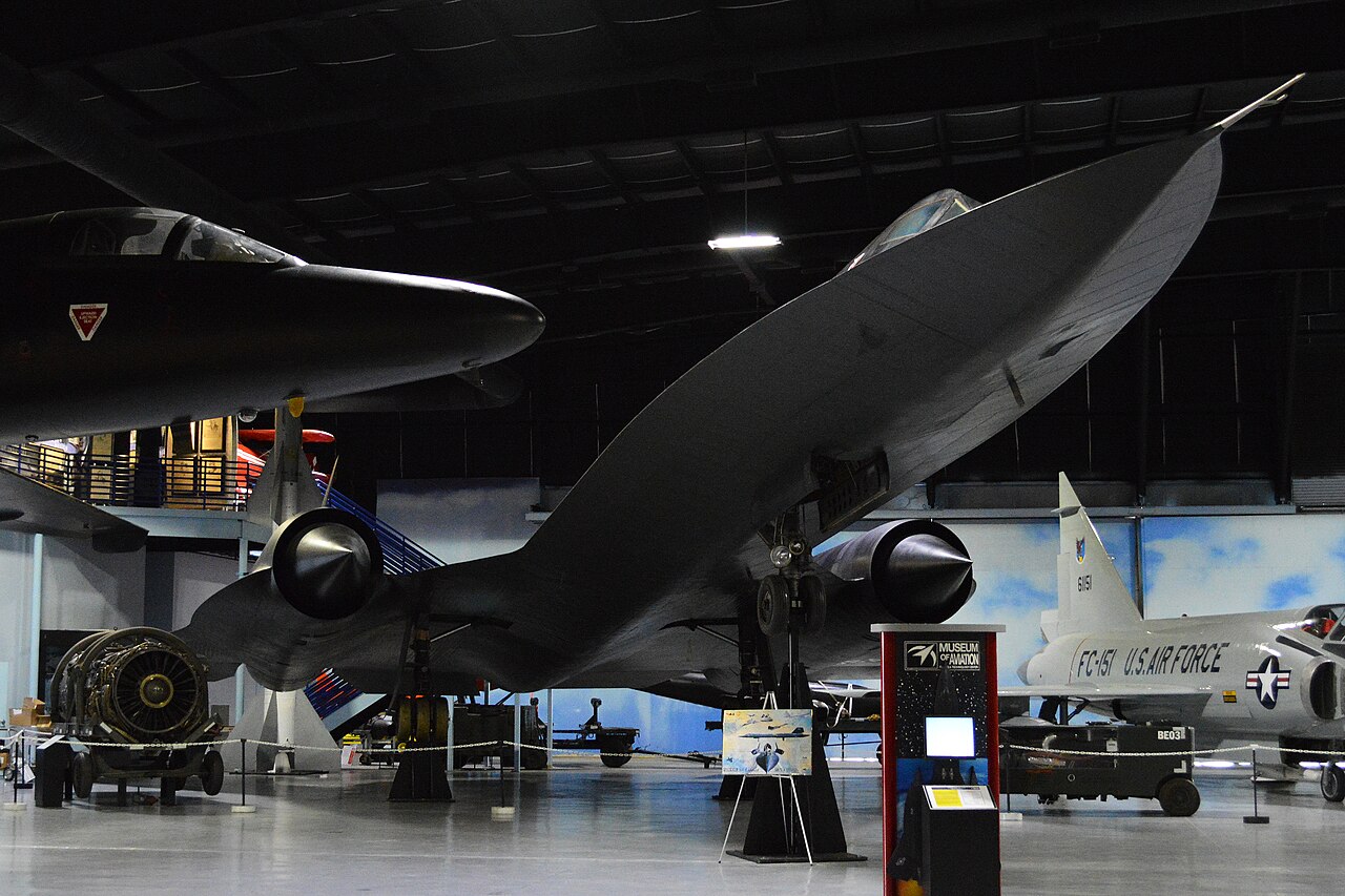 An SR-71 Blackbird and U-2 displayed inside the Museum of Aviation.